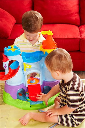 Boys Sitting on Floor Playing with Toys Stock Photo - Rights-Managed, Code: 700-02833641