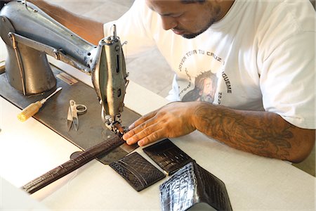 Man Sewing Leather Goods, Maida's Black Jack Boot Company, Houston, Texas, USA Stock Photo - Rights-Managed, Code: 700-02912107