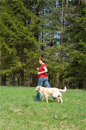 Pregnant Woman Walking With Dog Stock Photo - Rights-Managed, Code: 700-02922761