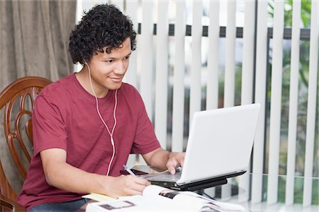 simsearch:400-04704759,k - Teenager Doing Homework and Using Laptop Computer Stock Photo - Rights-Managed, Code: 700-02957642