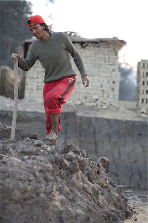 Man Standing in Mud, Chapagaon, Nepal Stock Photo - Rights-Managed, Code: 700-02957848