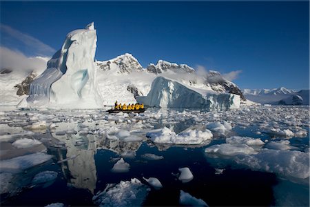 Tourists in Zodiac Boat by Iceberg, Antarctica Stock Photo - Rights-Managed, Code: 700-02967473