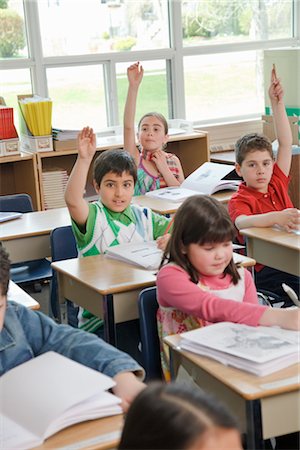 Children in Grade Three Classroom Raising Hands Stock Photo - Rights-Managed, Code: 700-02989939
