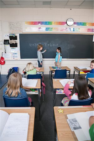 simsearch:700-01954522,k - Children in Grade Three Classroom Writing on the Chalkboard Stock Photo - Rights-Managed, Code: 700-02989940