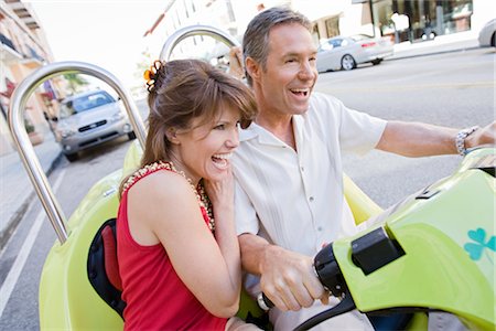 Couple on Vacation Riding Scooter Stock Photo - Rights-Managed, Code: 700-03004050