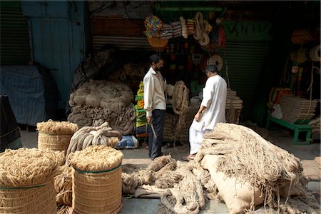 Man Selling Textiles at Market, Kolkata, West Bengal, India Stock Photo - Rights-Managed, Code: 700-03004169