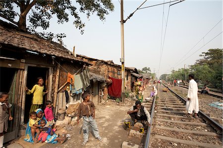 slums - People Living near Train Tracks, Tilijara, Kolkata, West Bengal, India Stock Photo - Rights-Managed, Code: 700-03004181