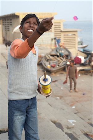 flying kites pictures - Boy Flying a Kite, Varanasi, Uttar Pradesh, India Stock Photo - Rights-Managed, Code: 700-03004219