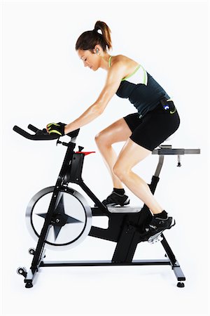 self discipline - Woman Riding Stationary Bicycle Stock Photo - Rights-Managed, Code: 700-03004419