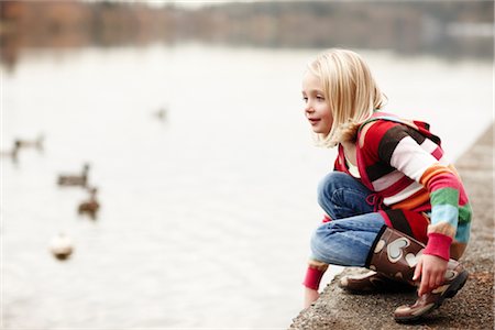 rubber boots in little girl - Girl by Lake Stock Photo - Rights-Managed, Code: 700-03075874