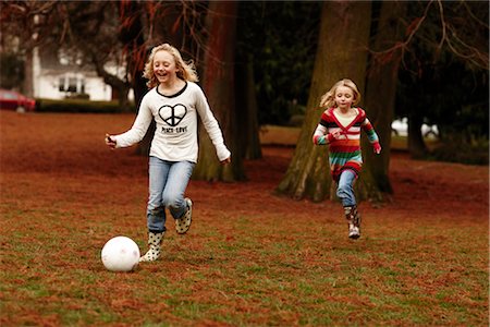 rubber boots in little girl - Girls Playing Soccer Stock Photo - Rights-Managed, Code: 700-03075871