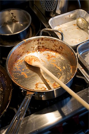 dirty and messy kitchen - Dirty Pots and Pans on the Stove Stock Photo - Rights-Managed, Code: 700-03178992