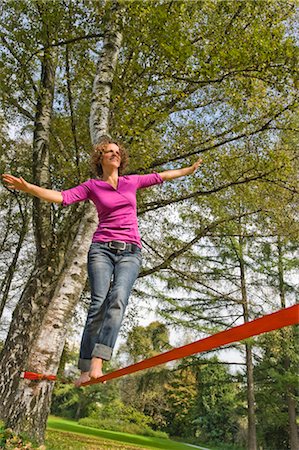 red ropes - Woman Slacklining Stock Photo - Rights-Managed, Code: 700-03179151