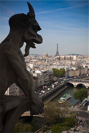 Gargoyle Overlooking City from Notre Dame Cathedral, Paris, France Stock Photo - Rights-Managed, Code: 700-03210661