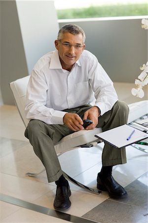Man Using Cell Phone at Home Stock Photo - Rights-Managed, Code: 700-03228670