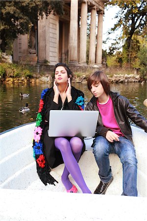 Woman and Boy Listening to Music Outdoors Stock Photo - Rights-Managed, Code: 700-03229320