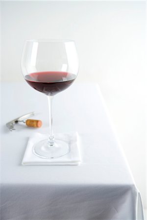 Glass of Red Wine on Table Stock Photo - Rights-Managed, Code: 700-03265799