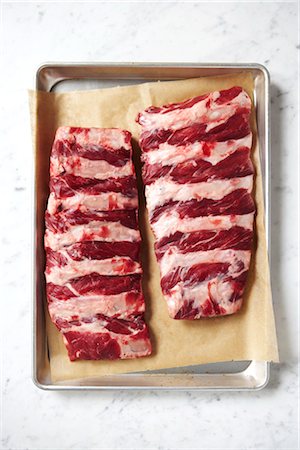 rib - Uncooked Ribs in Baking Tray Foto de stock - Con derechos protegidos, Código: 700-03265806