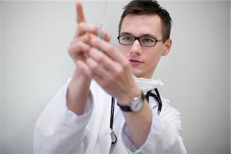 doctor intern male white - Doctor Holding Syringe Stock Photo - Rights-Managed, Code: 700-03284298