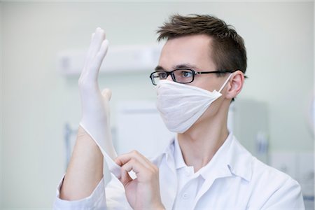 doctor intern male white - Doctor Putting on Gloves Stock Photo - Rights-Managed, Code: 700-03284317