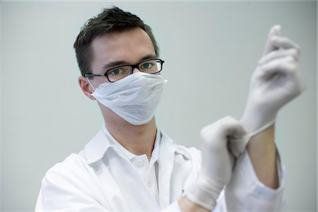 doctor intern male white - Doctor Putting on Gloves Stock Photo - Rights-Managed, Code: 700-03284318