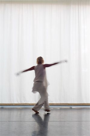 Woman Dancing in Front of a White Curtain, Salzburg, Salzburger Land, Austria Stock Photo - Rights-Managed, Code: 700-03299222