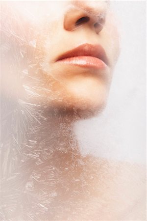 Woman's Lips Behind Frozen Glass Stock Photo - Rights-Managed, Code: 700-03290047