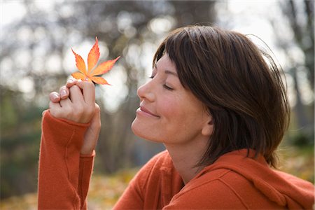 recharging - Woman Holding Autumn Leaf Stock Photo - Rights-Managed, Code: 700-03290235