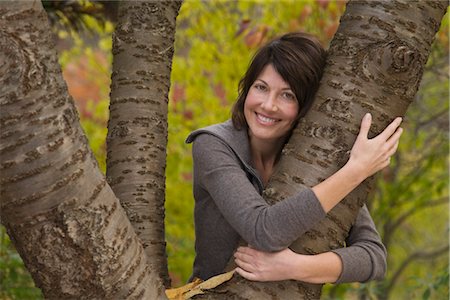 Woman Hugging Tree Foto de stock - Con derechos protegidos, Código: 700-03290248