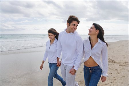 ethnic family holding hands - Group of People Walking on the Beach Stock Photo - Rights-Managed, Code: 700-03392496