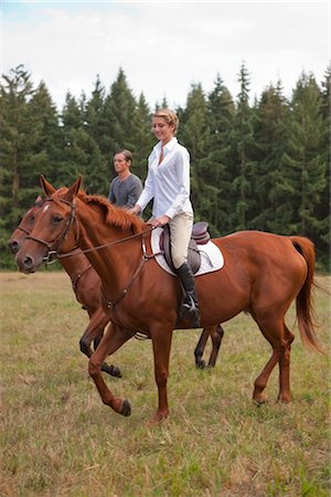 Couple Riding Horses, Brush Prairie, Washington, USA Stock Photo - Rights-Managed, Code: 700-03407778