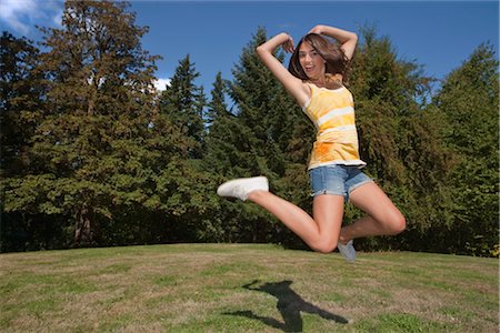 Teenage Girl Jumping in Air Stock Photo - Rights-Managed, Code: 700-03407880