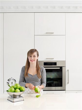 Young Woman Peeling Apples Stock Photo - Rights-Managed, Code: 700-03407944
