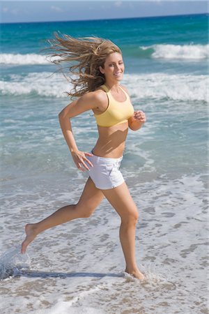 Woman Running on the Beach Stock Photo - Rights-Managed, Code: 700-03435344