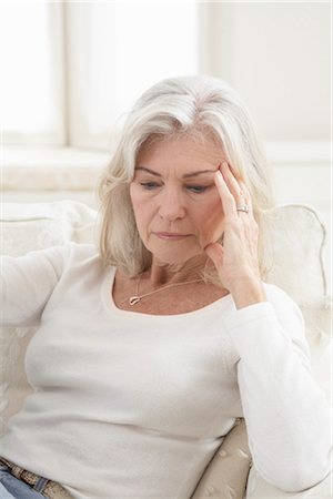 Woman Sitting on Sofa Stock Photo - Rights-Managed, Code: 700-03438998