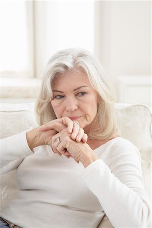 Woman Sitting on Sofa Stock Photo - Rights-Managed, Code: 700-03439000