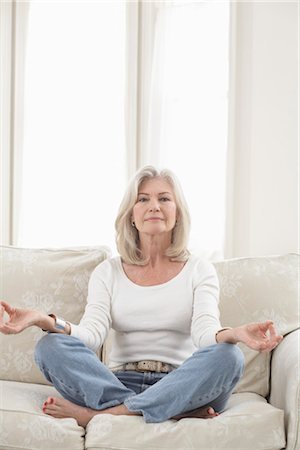 seniors yoga class - Woman Meditating in Living Room Stock Photo - Rights-Managed, Code: 700-03439012