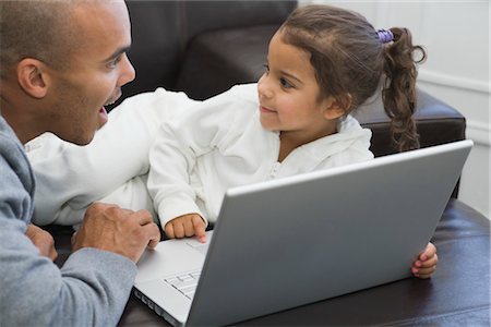 Father and Daughter Using a Laptop Computer Stock Photo - Rights-Managed, Code: 700-03439073
