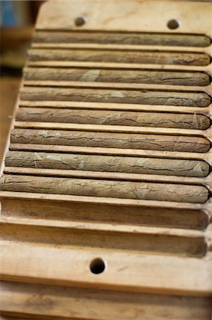eight (quantity) - Hand Rolled Cigars in Holder, Tarpon Springs, Florida, USA Stock Photo - Rights-Managed, Code: 700-03439243