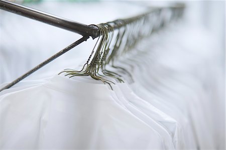 White Shirts Hanging on Hangers Stock Photo - Rights-Managed, Code: 700-03446174