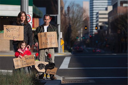 family group portrait caucasian - Family Holding Signs on Street Corner Stock Photo - Rights-Managed, Code: 700-03455680