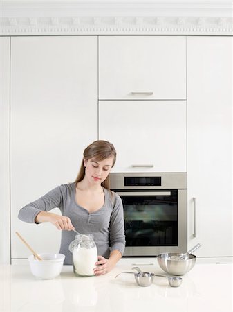 Woman Measuring Flour Stock Photo - Rights-Managed, Code: 700-03451390