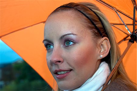Femme tenant un parapluie Photographie de stock - Rights-Managed, Code: 700-03451467