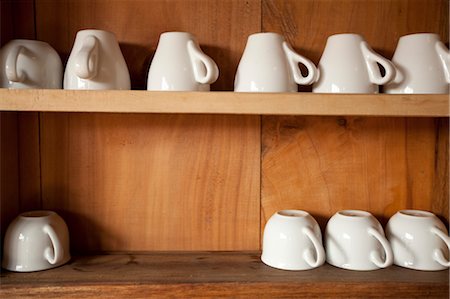 Row of Coffee Cups on Shelf Stock Photo - Rights-Managed, Code: 700-03466360