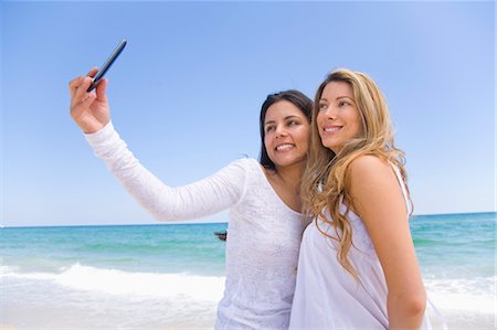 Women Taking Picture with Cellular Telephone Stock Photo - Rights-Managed, Code: 700-03466804