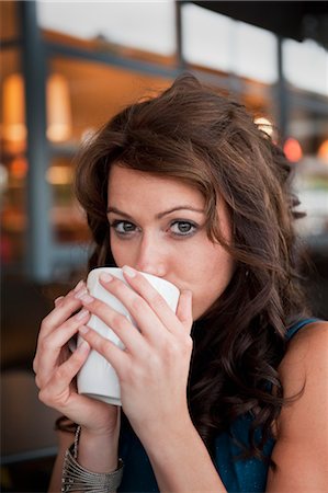 Woman Drinking from Mug at Outdoor Cafe, London, England Stock Photo - Rights-Managed, Code: 700-03490346