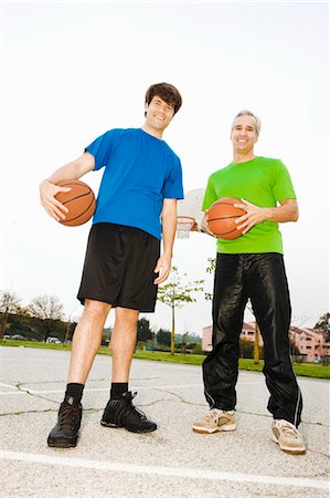father son basketball - Father and Son on Basketball Court Stock Photo - Rights-Managed, Code: 700-03506294