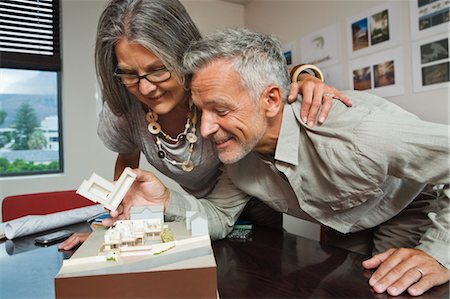 Mature Couple Looking at Architect's New Home Model Stock Photo - Rights-Managed, Code: 700-03501265