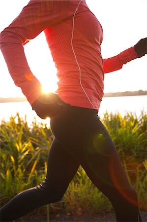 running in the fall - Femme en cours d'exécution au coucher du soleil dans le parc du lac vert, Seattle, Washington, USA Photographie de stock - Rights-Managed, Code: 700-03554490