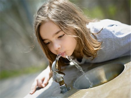 Girl Drinking Water from Drinking Fountain Stock Photo - Rights-Managed, Code: 700-03556895
